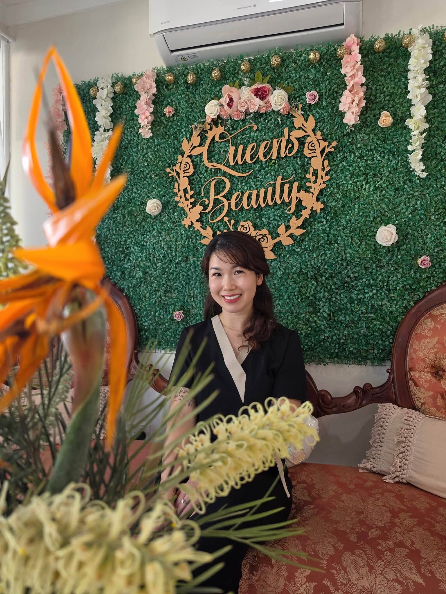 Quinnie seated in the Queen's Beauty reception area
